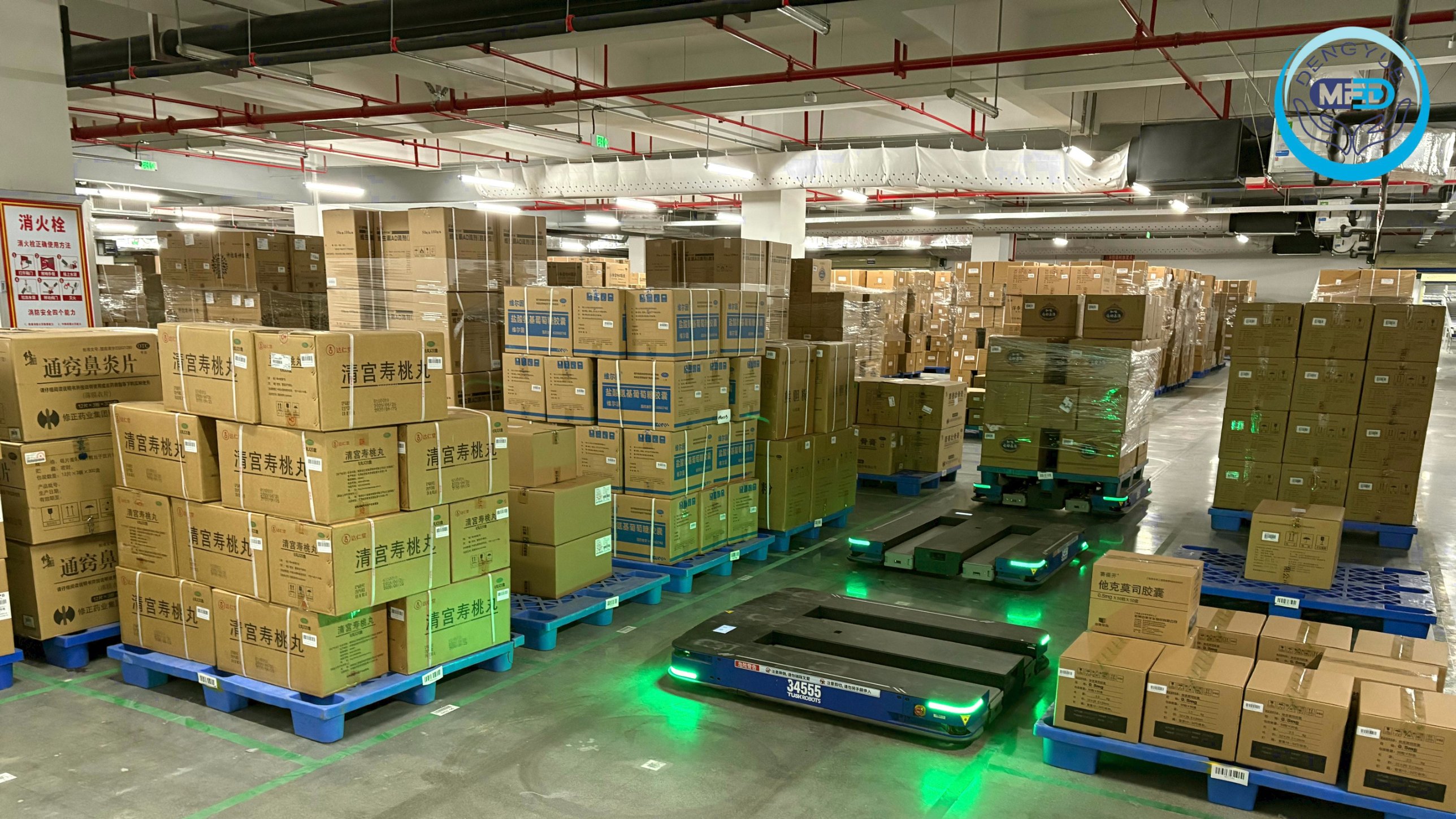 DengYueMed warehouse with palletized medicines and automated guided vehicles