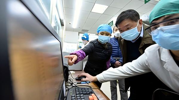 Clinical team reviewing patient data on screen